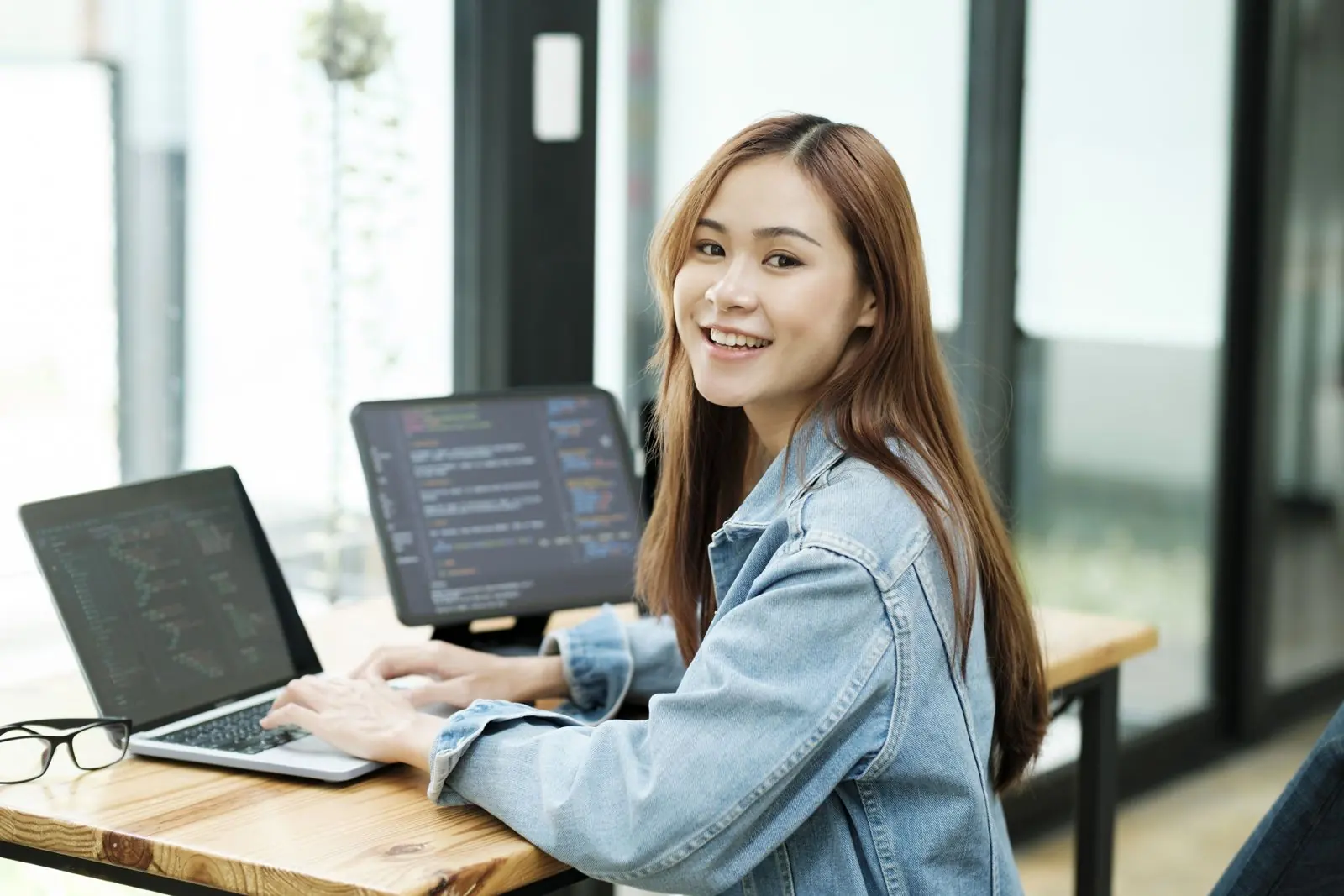 Business owner and WordPress developer reviewing a website together on a laptop